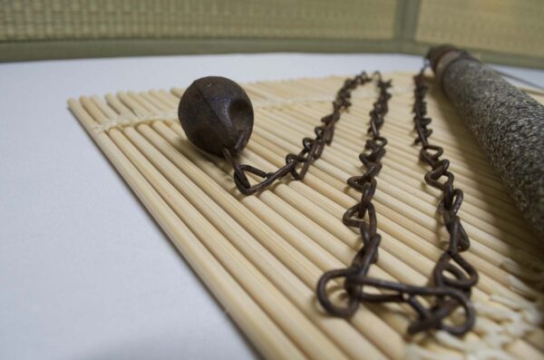 Kusarigama ninja weapon with curved sickle and long chain