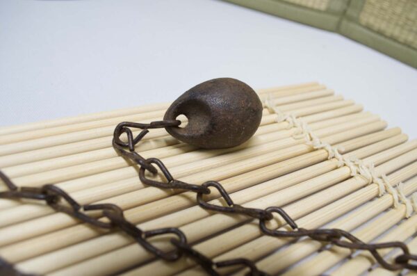 Kusarigama ninja weapon with curved sickle and long chain