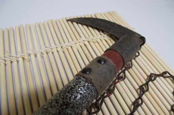 Kusarigama ninja weapon with curved sickle and long chain