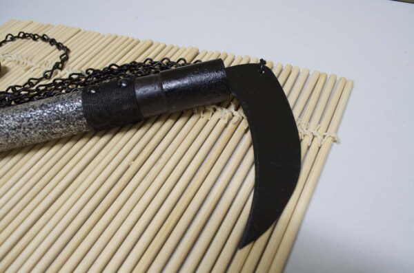 Kusarigama ninja weapon with curved sickle and long chain
