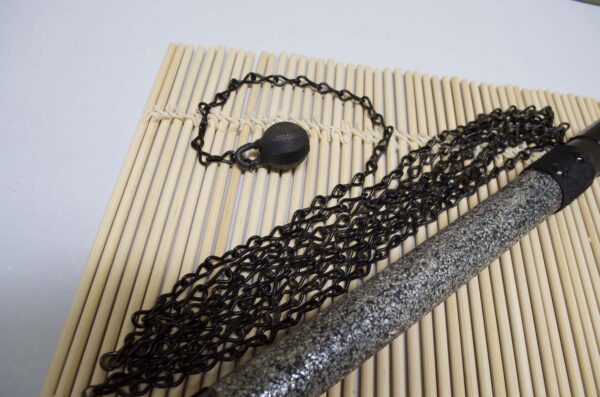 Kusarigama ninja weapon with curved sickle and long chain