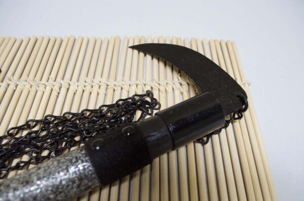 Kusarigama ninja weapon with curved sickle and long chain